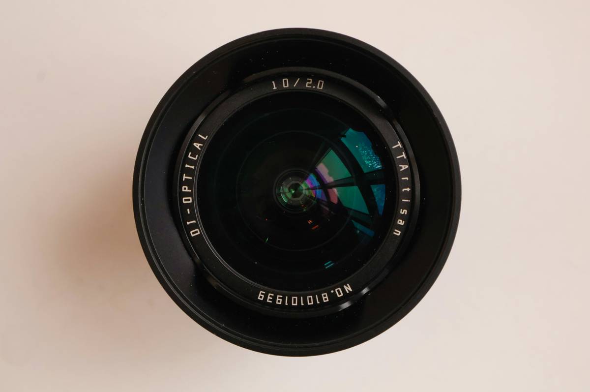 Close-up of a camera lens on a white background